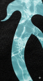 Close-up of aqua blue water-patterned graphic on black oversized streetwear t-shirt